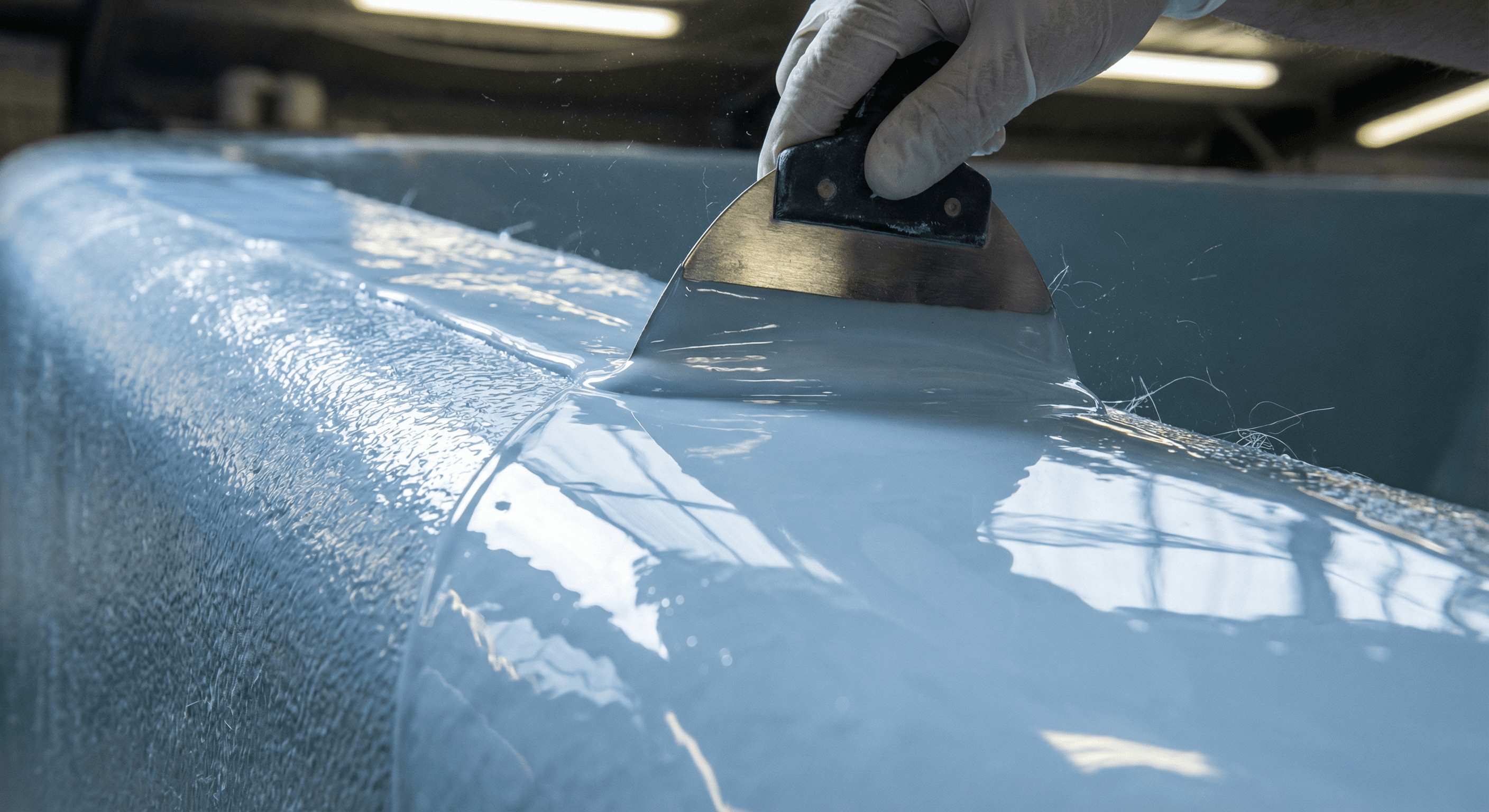 Professional gelcoat application on fibreglass pool surface